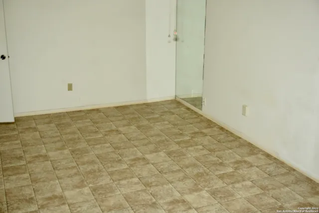 a view of kitchen with granite countertop and sink