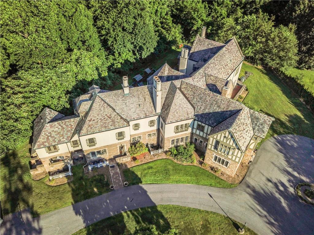 an aerial view of a house with table and chairs