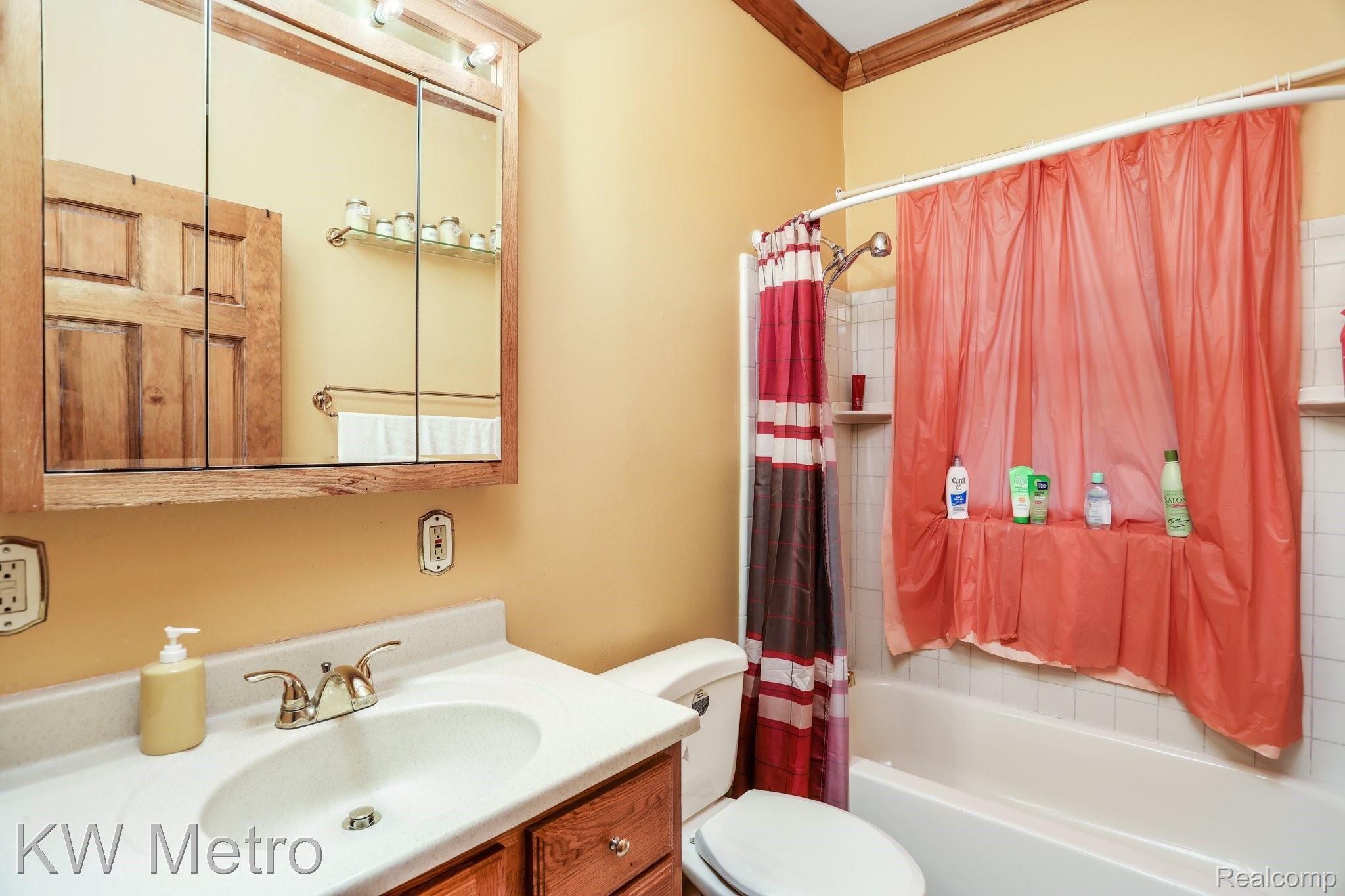 2428 Cambridge Road Berkley, MI 48072 - Photo 16 of 35 The main floor bathroom has timeless ceramic tiles.