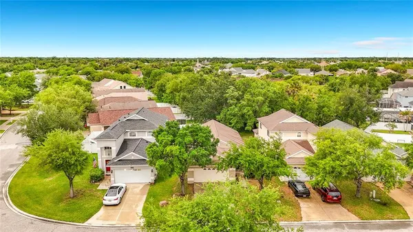 an aerial view of a house with a lake view