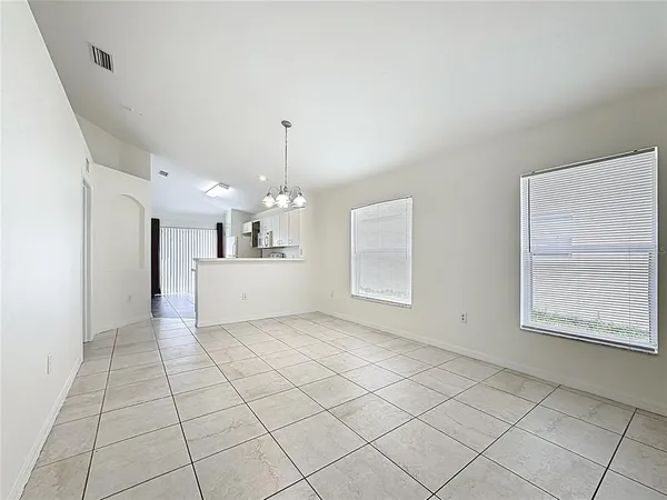 a view of a kitchen with a sink and a window