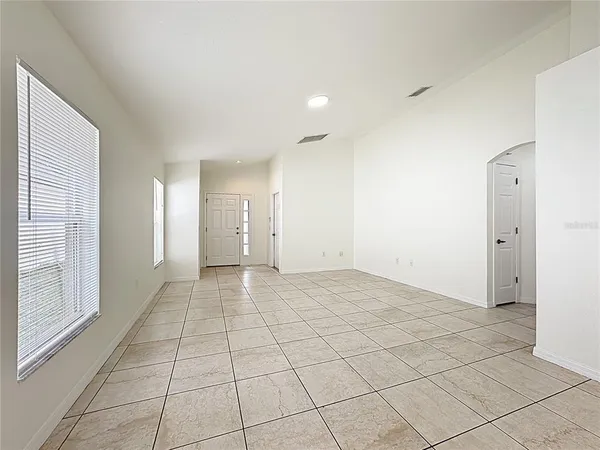 a view of an empty room and window