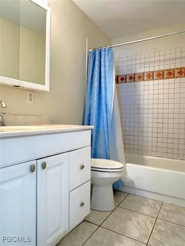 a view of a house with yard and ocean view