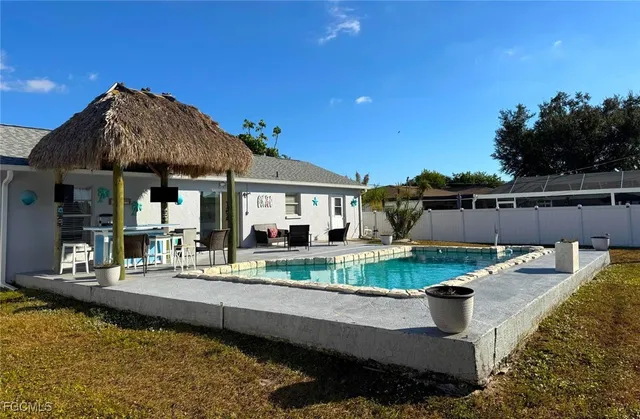 swimming pool view with a outdoor seating