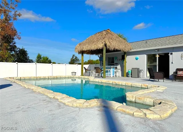 a patio with a table and chairs