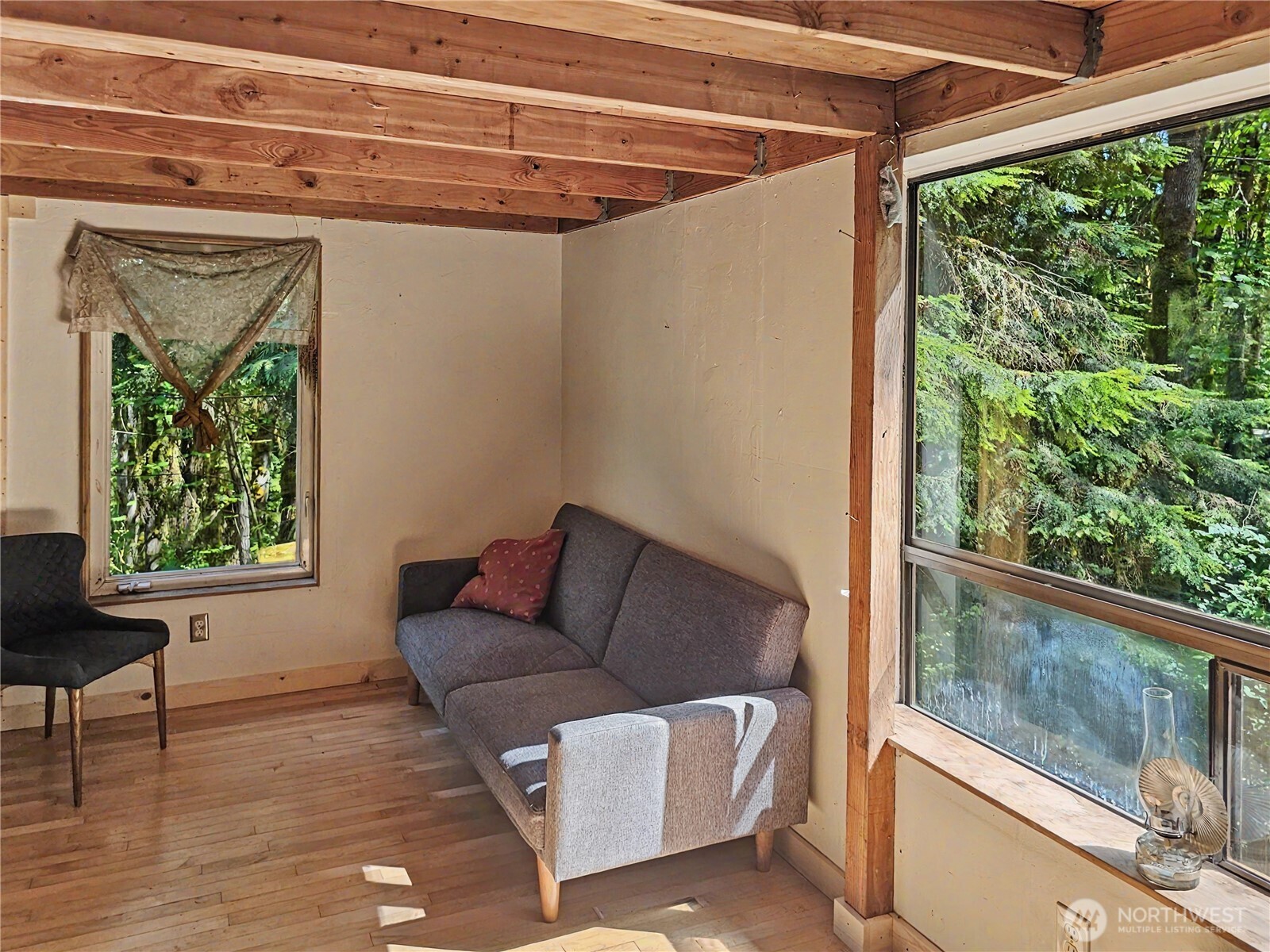 313 Larch Road Quilcene, WA 98376 - Photo 4 of 20 a living room with furniture and a window
