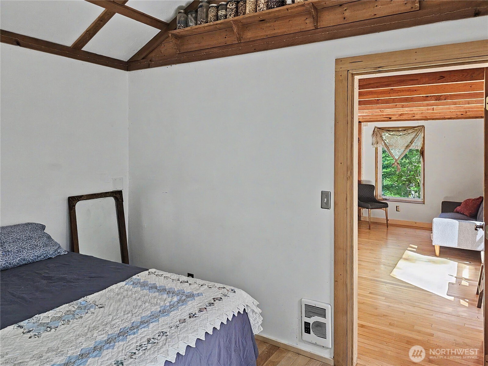 313 Larch Road Quilcene, WA 98376 - Photo 5 of 20 a bedroom with a bed and a window
