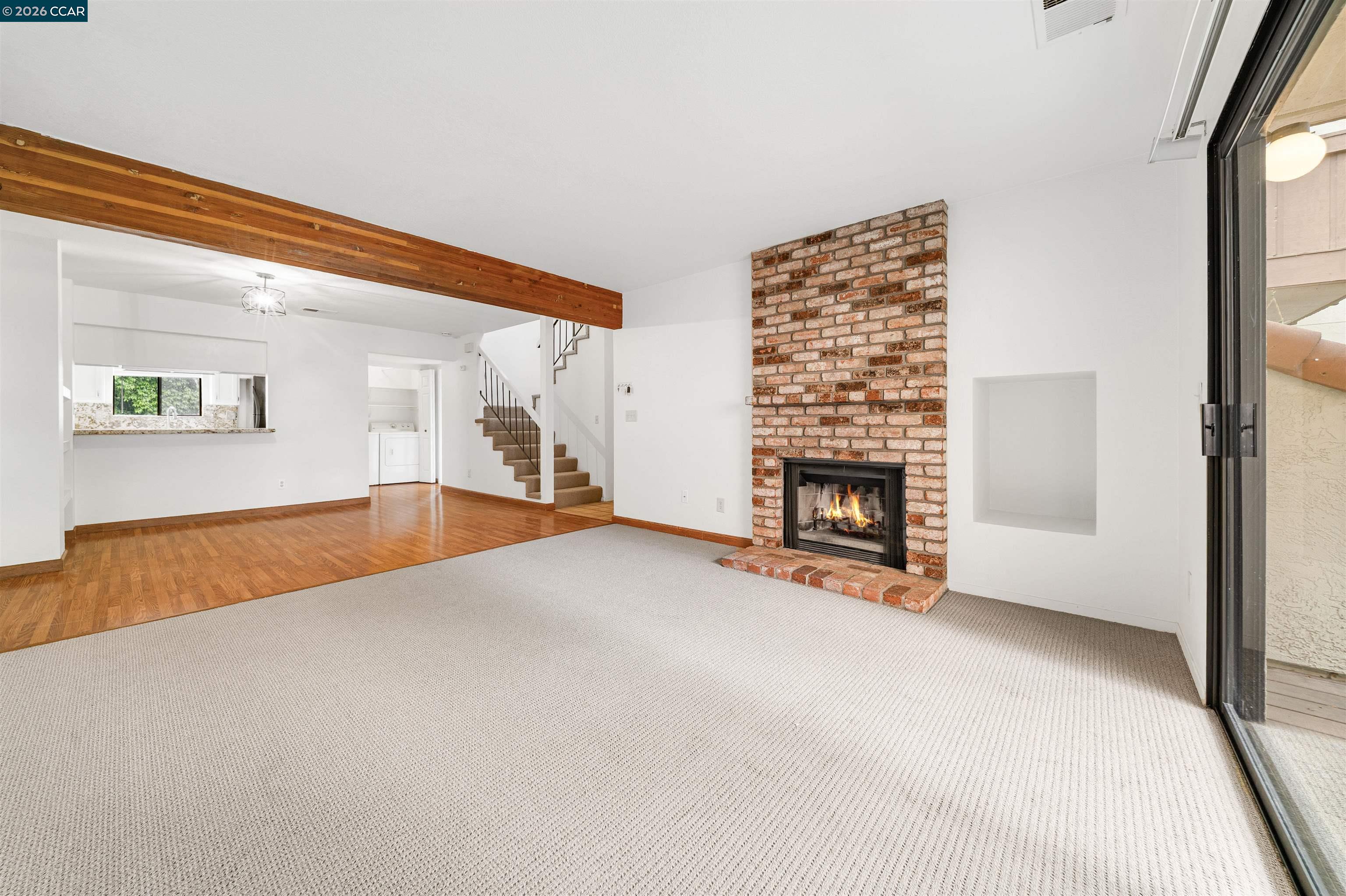 2055 Sierra Road, Unit 106 Concord, CA 94518 - Photo 7 of 37 a view of an empty room with a fireplace and a window