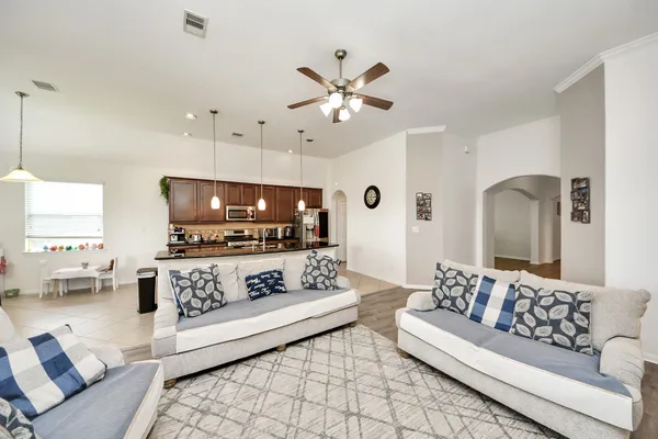 a kitchen with kitchen island a sink and appliances