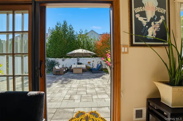 a kitchen with granite countertop a sink stove and cabinets