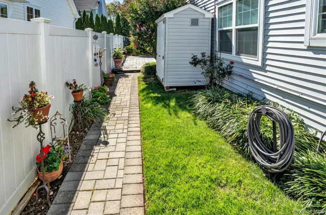 a view of a outdoor space with plants and sitting area
