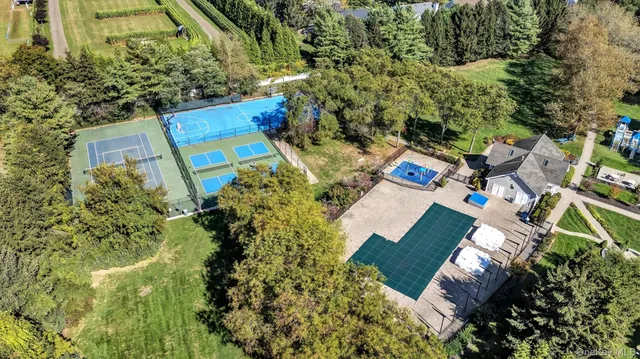 a front view of a house with swimming pool and porch