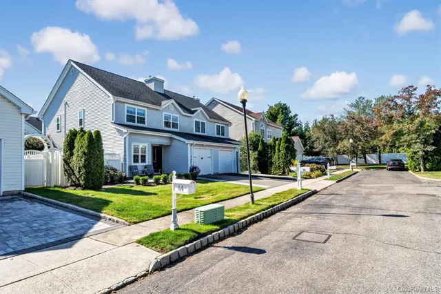 a front view of house with yard and swimming pool