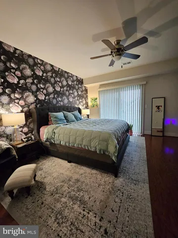 a bedroom with bed and window