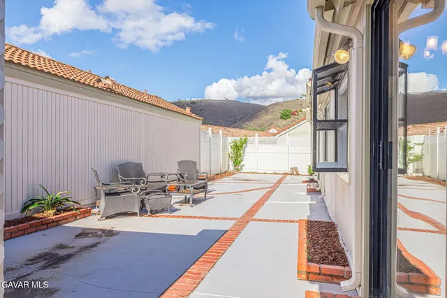 a view of a backyard of the house