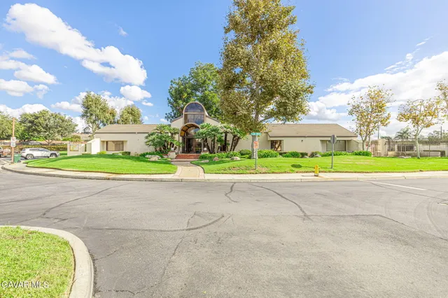 a view of a swimming pool with a lounge chairs