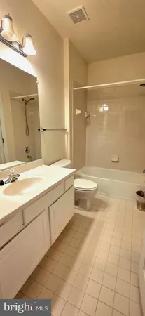 a bathroom with a bathtub and a sink