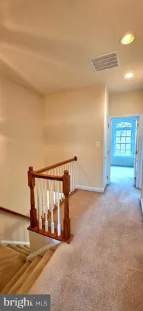 a view of an empty room with windows