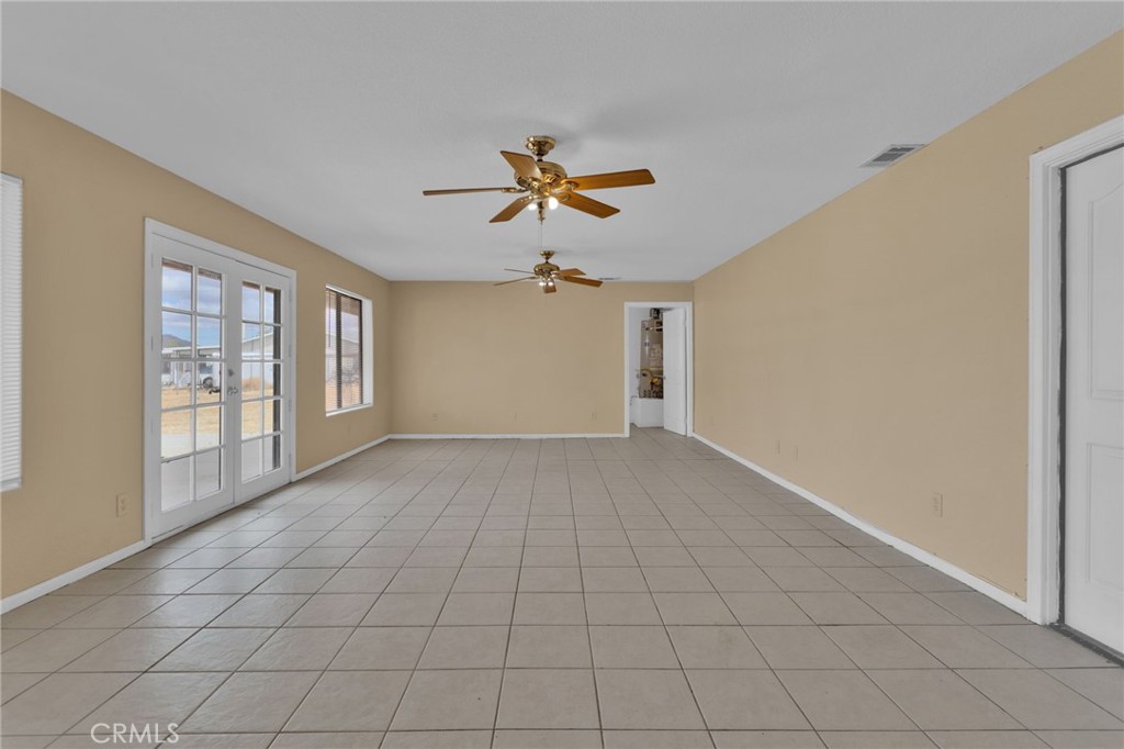 15160 Cheyenne Road Apple Valley, CA 92307 - Photo 17 of 55 wooden floor in an empty room with a window