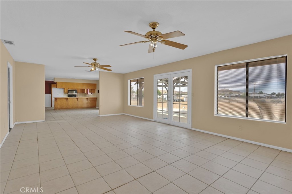 15160 Cheyenne Road Apple Valley, CA 92307 - Photo 18 of 55 a view of an empty room with a window