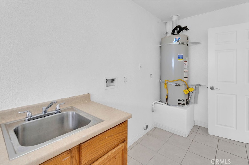 15160 Cheyenne Road Apple Valley, CA 92307 - Photo 20 of 55 a bathroom with a sink and mirror