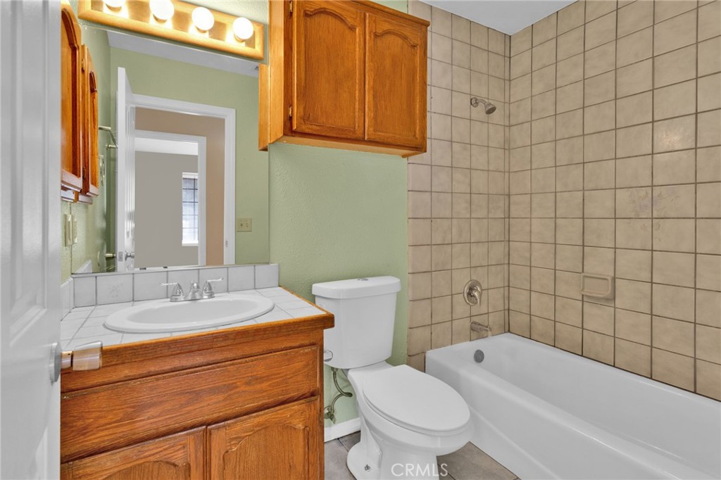 15160 Cheyenne Road Apple Valley, CA 92307 - Photo 24 of 55 a bathroom with a sink a toilet and shower