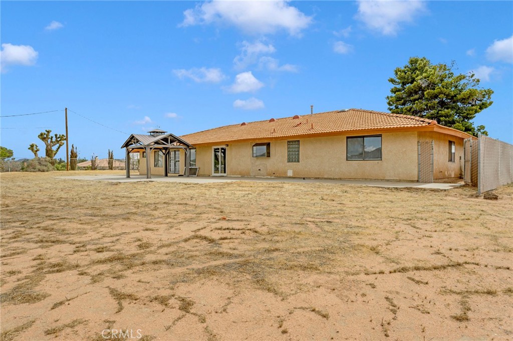 15160 Cheyenne Road Apple Valley, CA 92307 - Photo 44 of 55 a front view of a house with a yard
