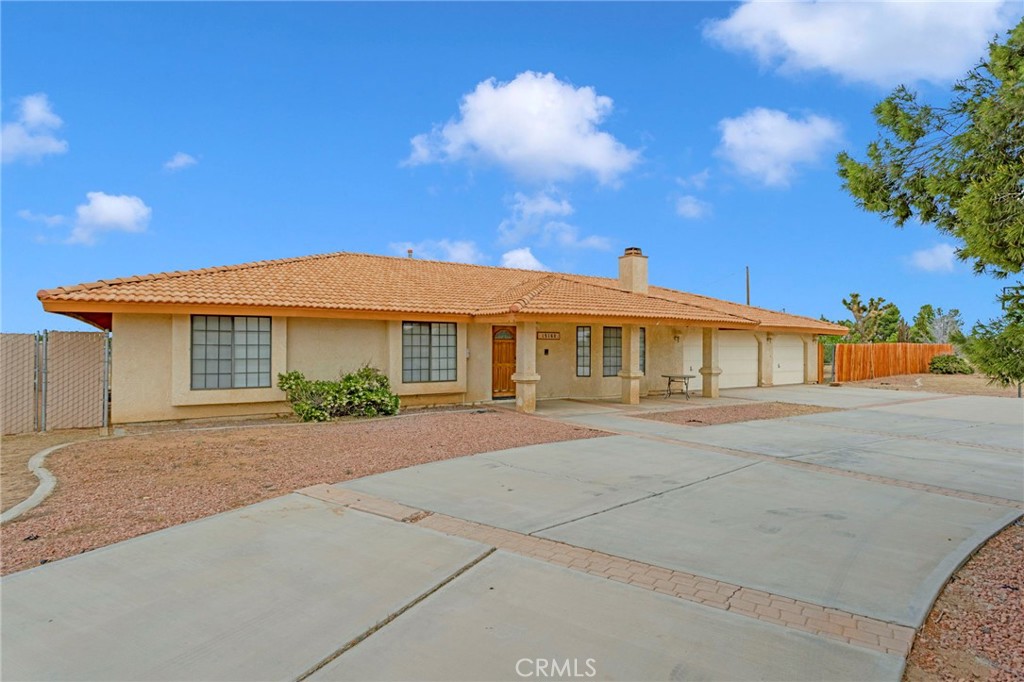 15160 Cheyenne Road Apple Valley, CA 92307 - Photo 54 of 55 a front view of a house with a yard