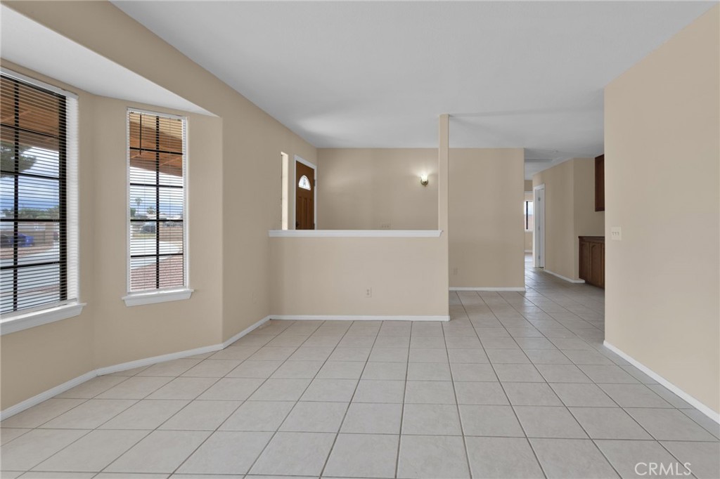 15160 Cheyenne Road Apple Valley, CA 92307 - Photo 7 of 55 a view of an empty room with a window