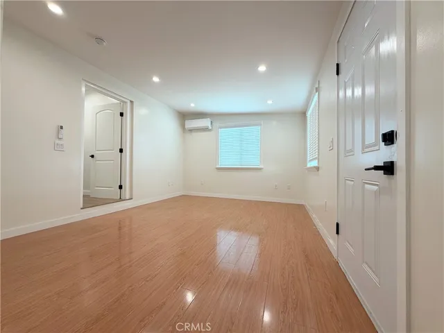 a view of hallway with wooden floor