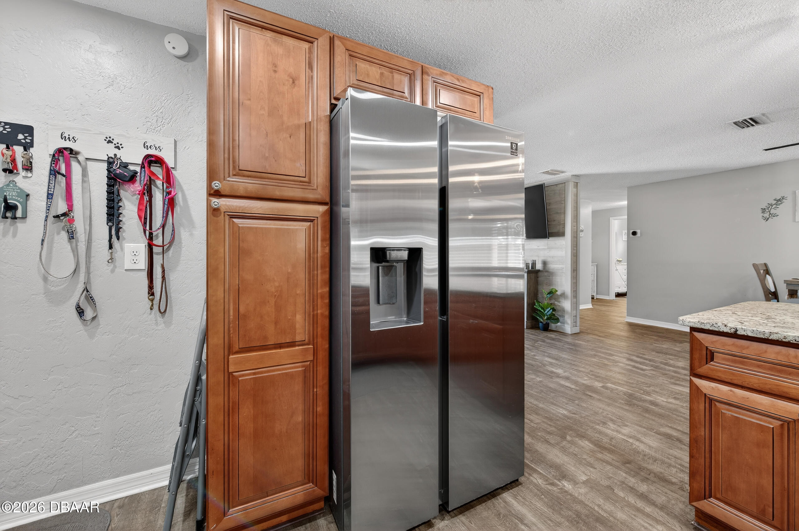 1010 Fernald Street Edgewater, FL 32132 - Photo 13 of 43 a kitchen with stainless steel appliances granite countertop a refrigerator and a sink
