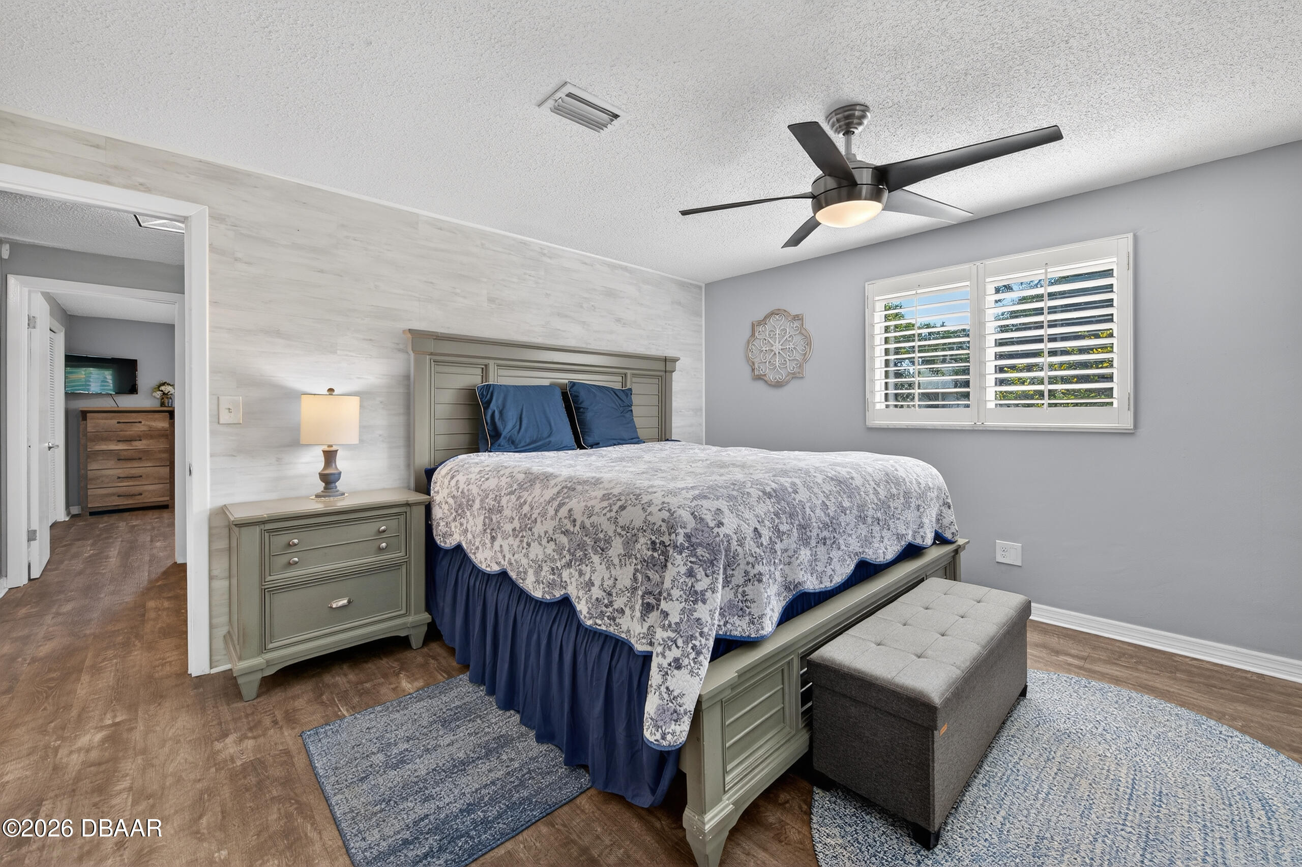 1010 Fernald Street Edgewater, FL 32132 - Photo 15 of 43 a bedroom with a bed and a dresser