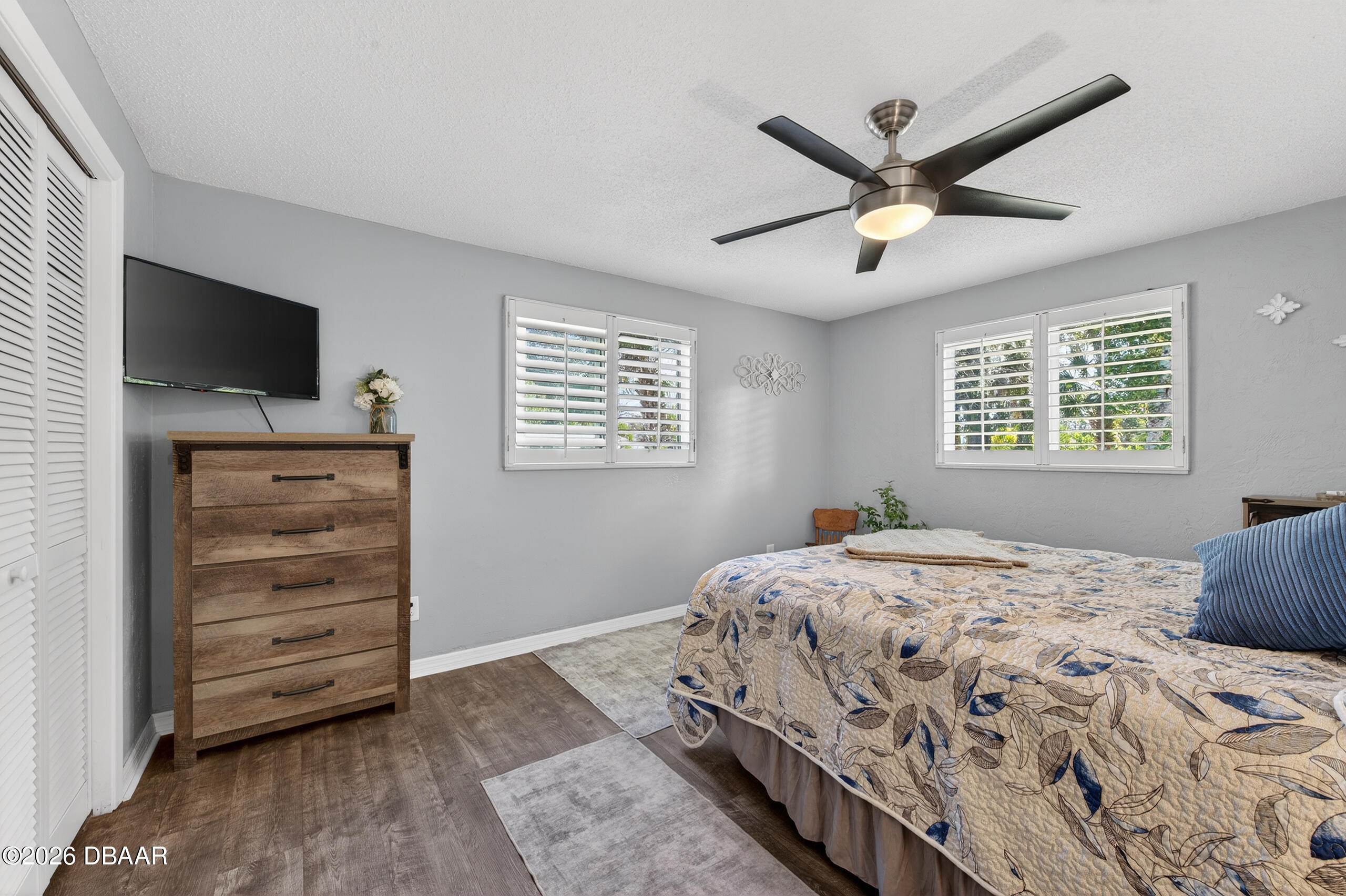 1010 Fernald Street Edgewater, FL 32132 - Photo 20 of 43 a bedroom with a bed and a flat screen tv