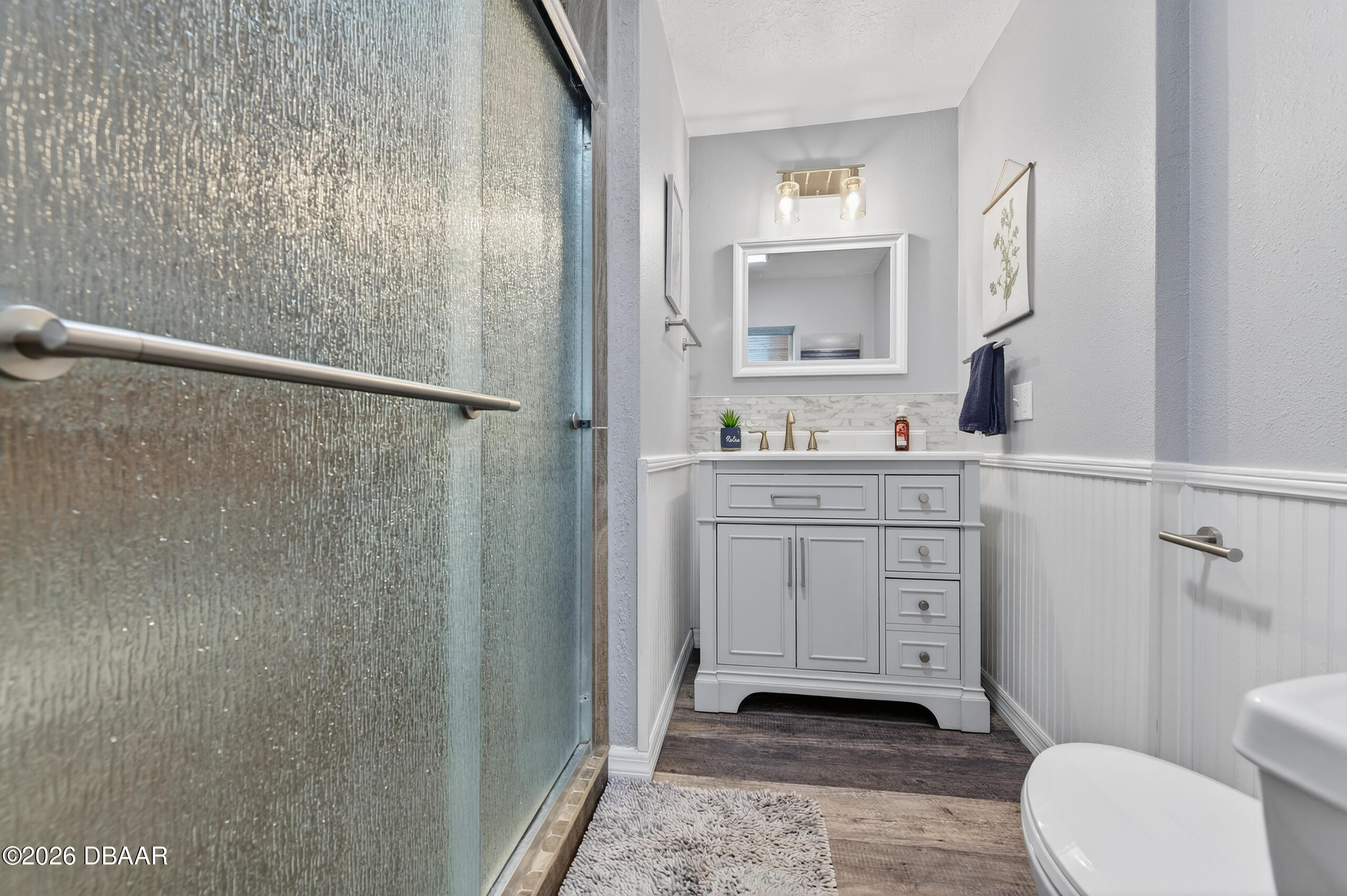 1010 Fernald Street Edgewater, FL 32132 - Photo 21 of 43 a bathroom with a sink a toilet a vanity and mirror