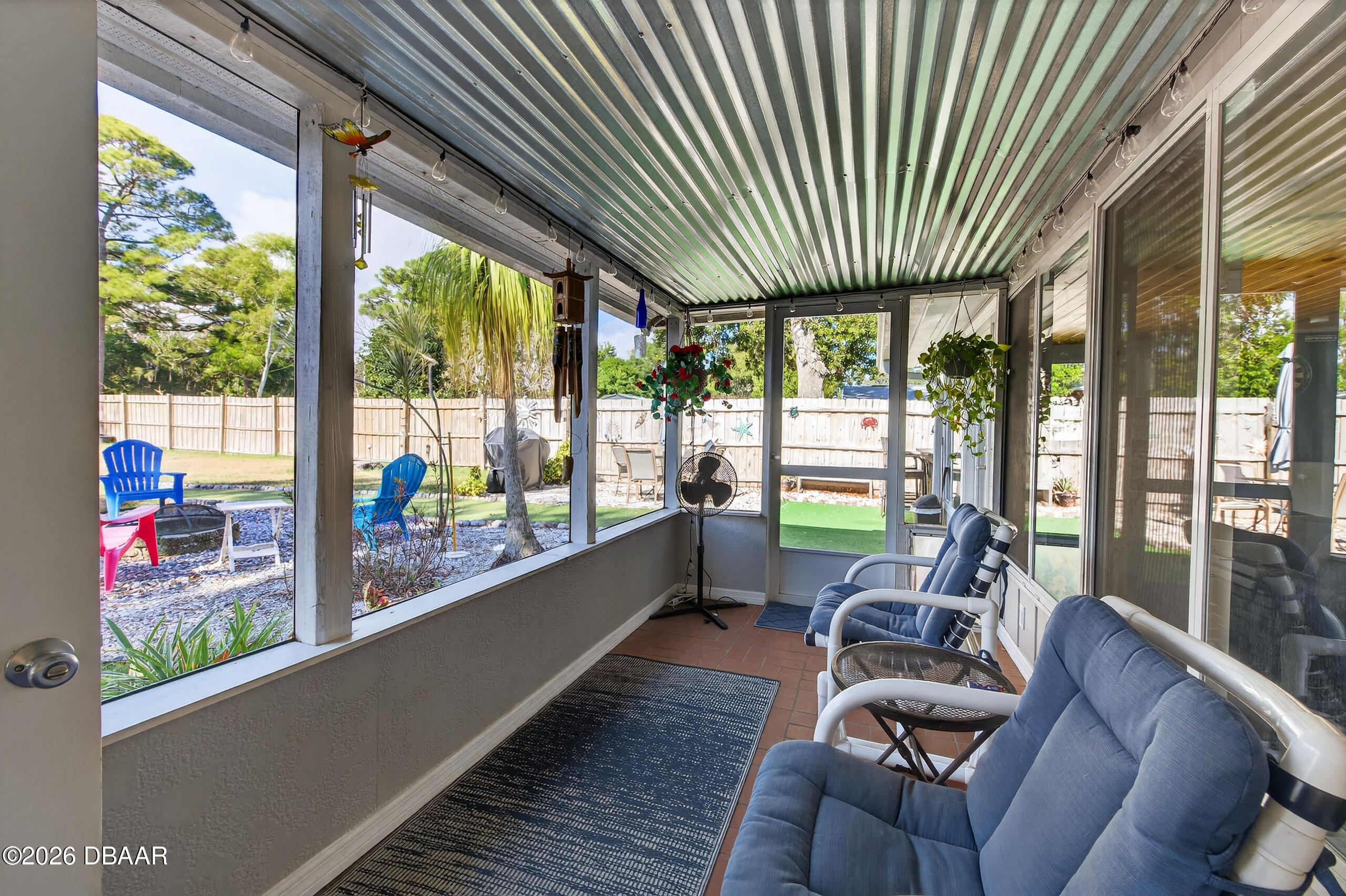 1010 Fernald Street Edgewater, FL 32132 - Photo 28 of 43 a living room with furniture and floor to ceiling windows
