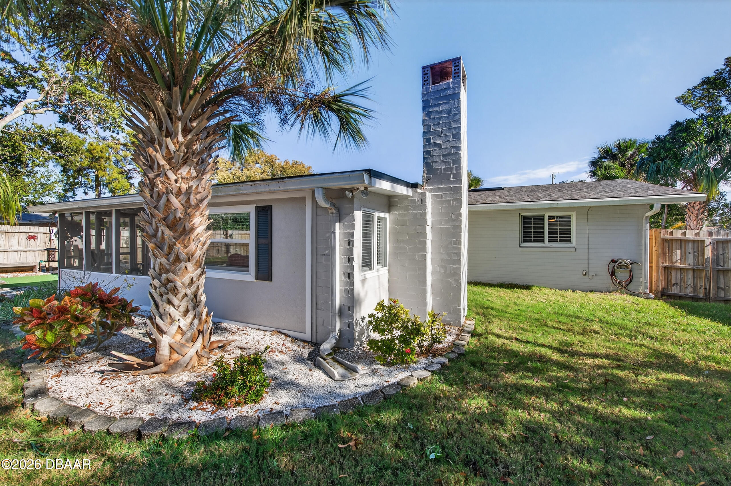 1010 Fernald Street Edgewater, FL 32132 - Photo 29 of 43 a front view of house with yard and trees around