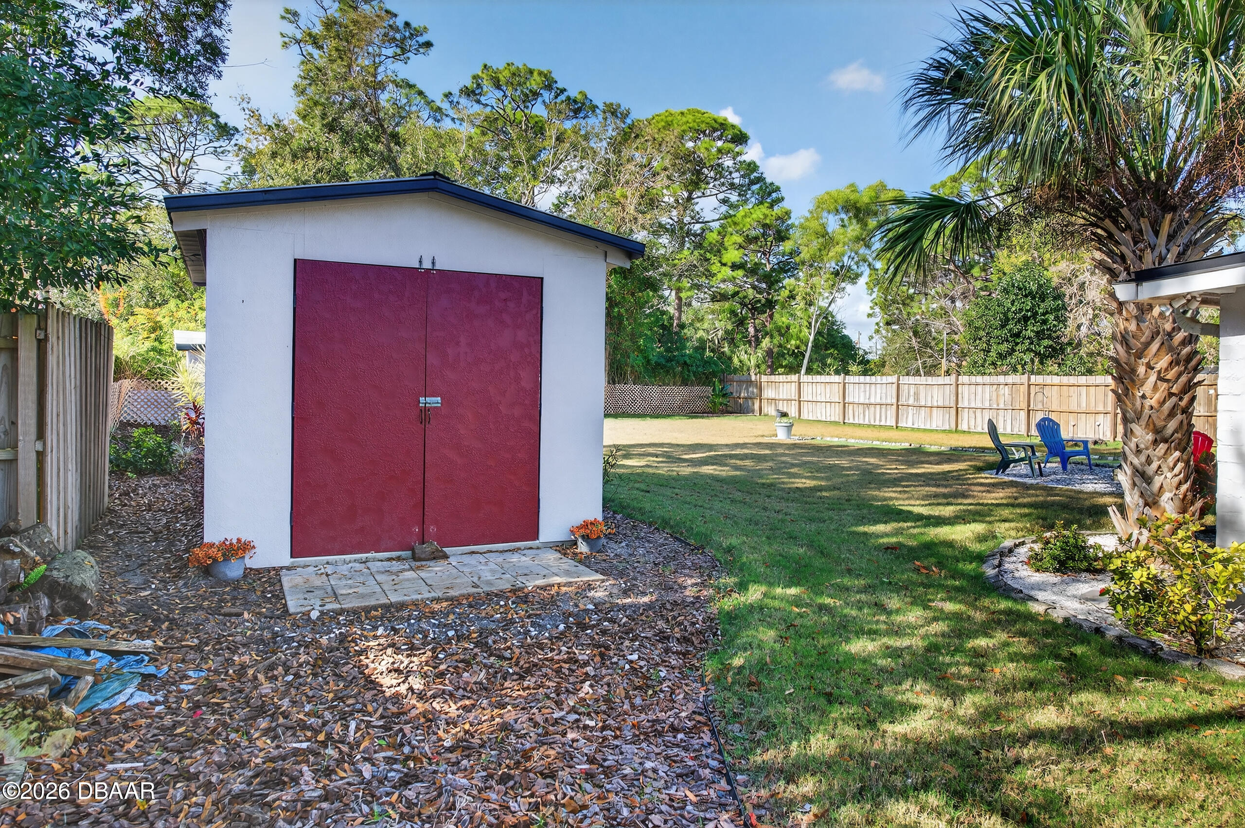 1010 Fernald Street Edgewater, FL 32132 - Photo 32 of 43 a view of backyard of house with green space
