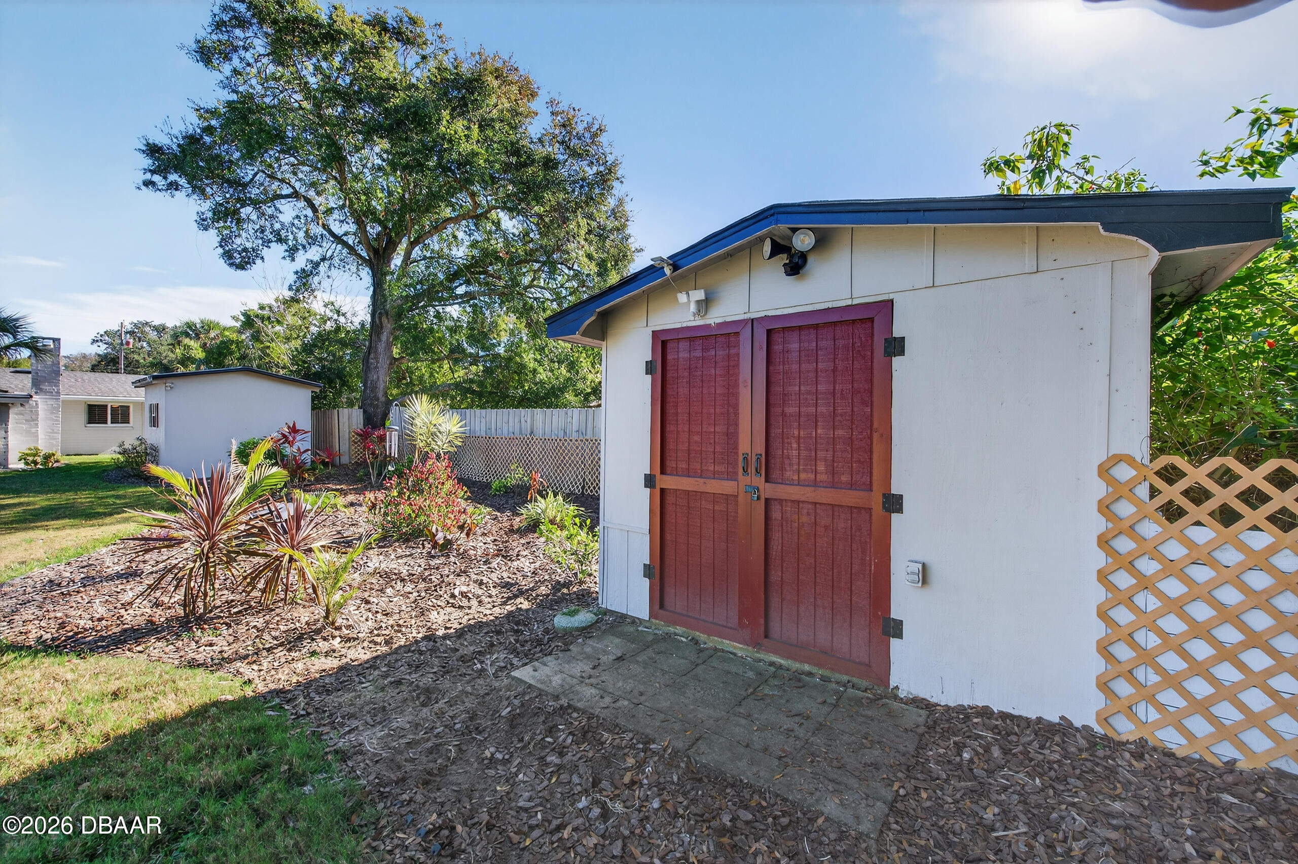 1010 Fernald Street Edgewater, FL 32132 - Photo 33 of 43 a front view of a house with garden