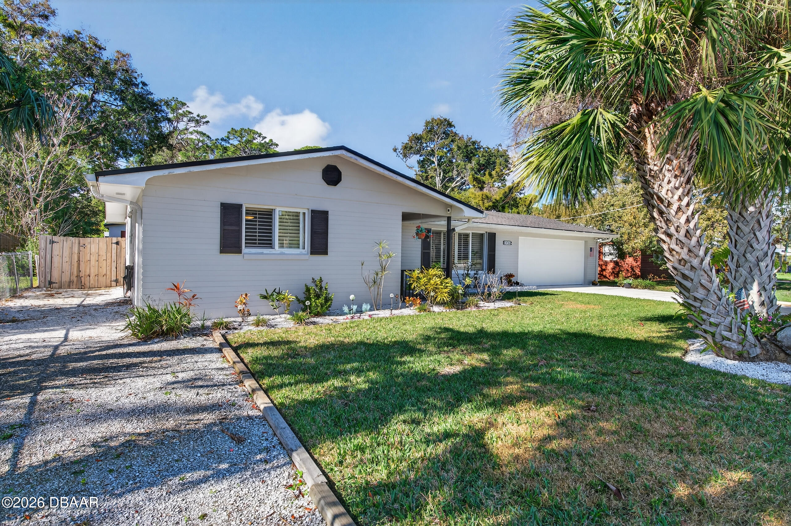 1010 Fernald Street Edgewater, FL 32132 - Photo 38 of 43 a front view of house with yard and green space