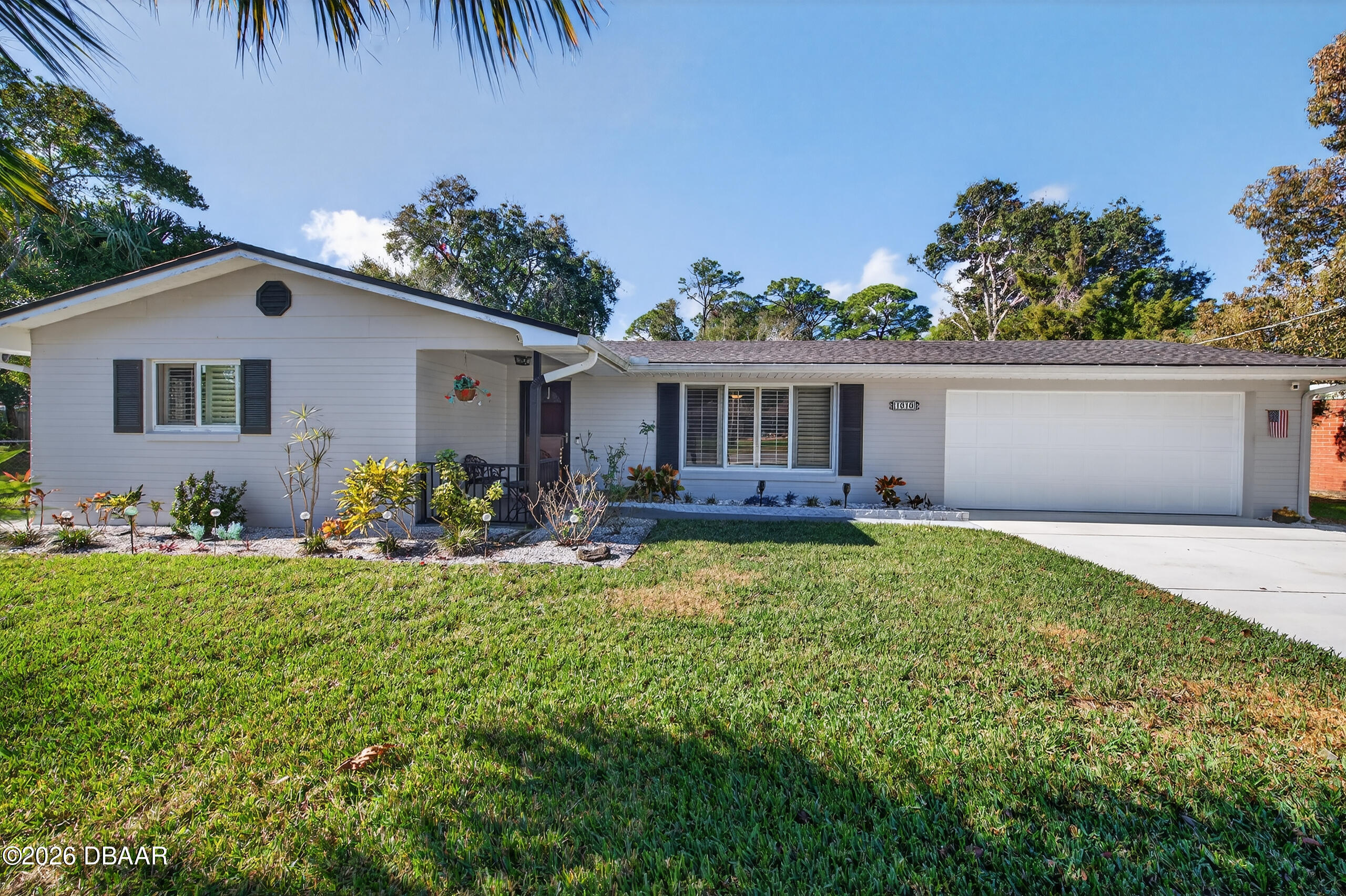 1010 Fernald Street Edgewater, FL 32132 - Photo 4 of 43 a front view of house with yard and outdoor seating
