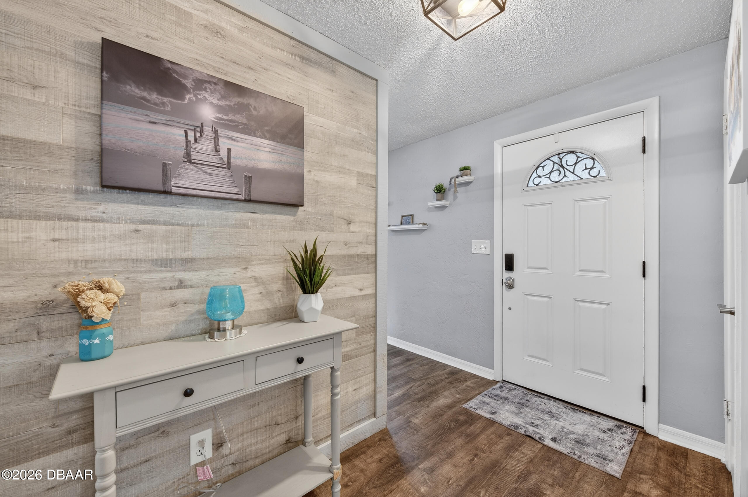 1010 Fernald Street Edgewater, FL 32132 - Photo 5 of 43 a view of front door with wooden floor