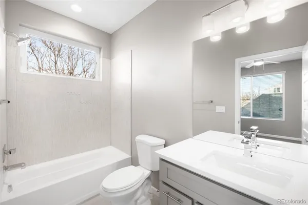 a bathroom with a sink double vanity and mirror