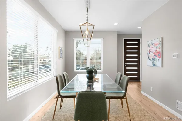 a large kitchen with stainless steel appliances kitchen island granite countertop a sink and cabinets