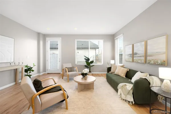 a living room with furniture and windows