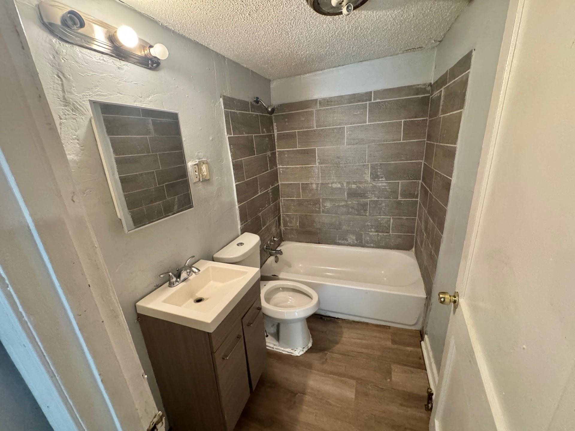 5299 Airview Road Memphis, TN 38109 - Photo 6 of 11 a bathroom with a sink toilet and shower