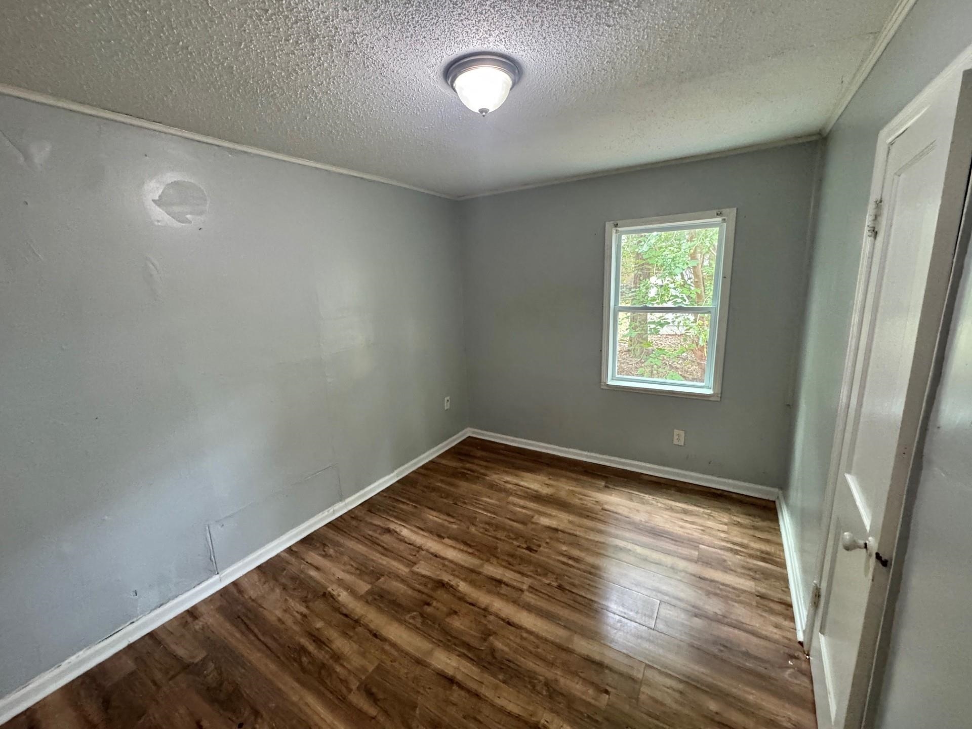 5299 Airview Road Memphis, TN 38109 - Photo 7 of 11 a view of an empty room and window