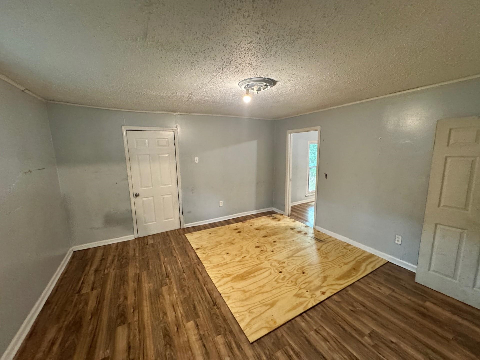 5299 Airview Road Memphis, TN 38109 - Photo 10 of 11 an empty room with wooden floor