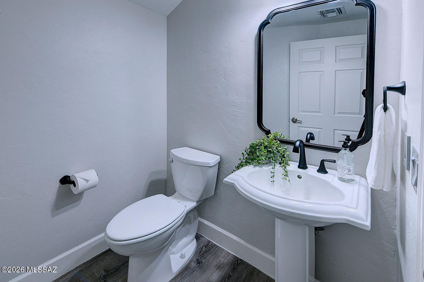 13464 North Piemonte Way Oro Valley, AZ 85755 - Photo 27 of 33 a bathroom with a sink a toilet and mirror