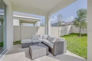 a living room with furniture and a garden