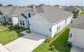 a aerial view of a house with a yard